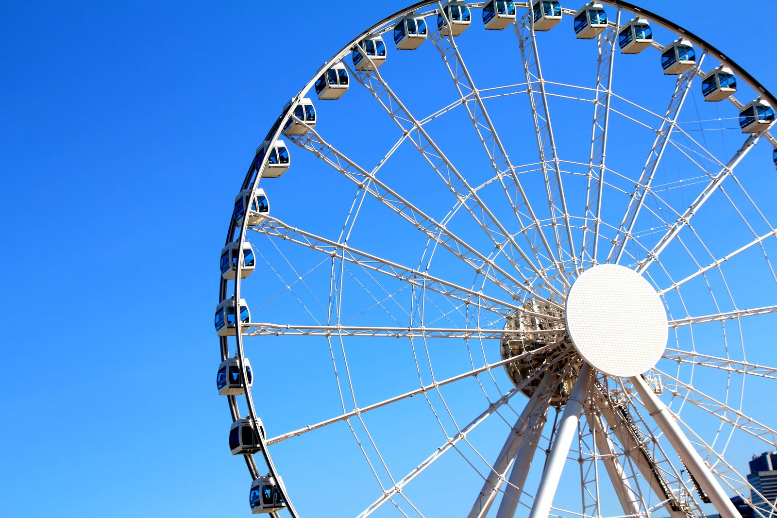 The Hong Kong Observation Wheel against a bright blue sky